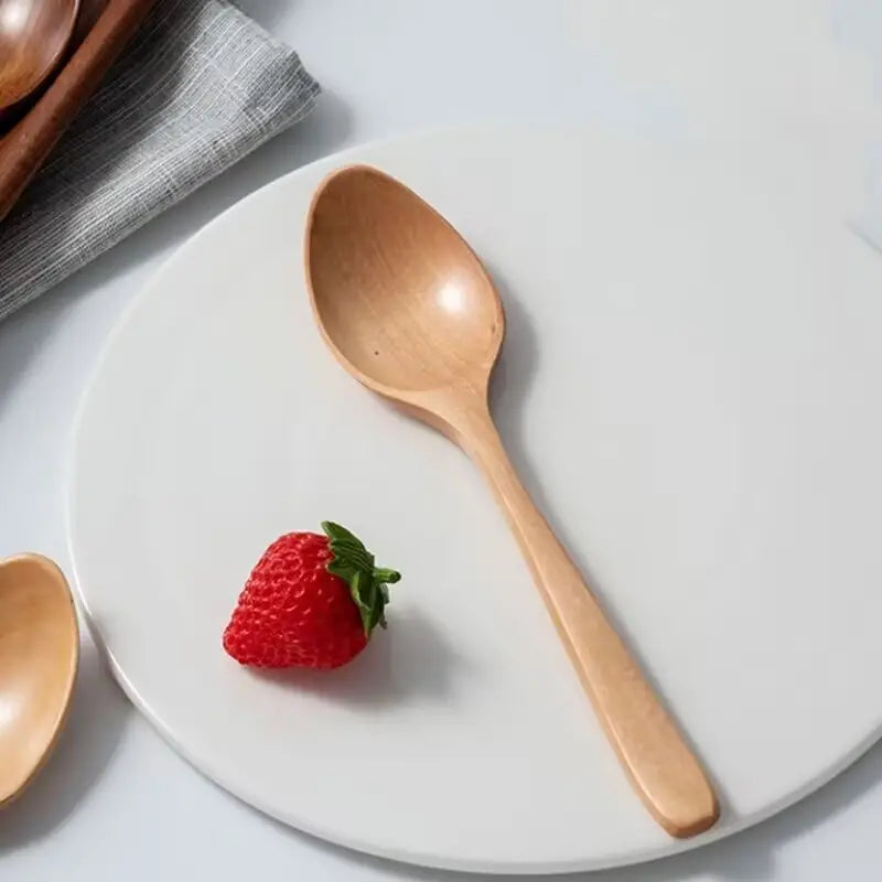 Full set of wooden spoons, each designed for different cooking needs.
