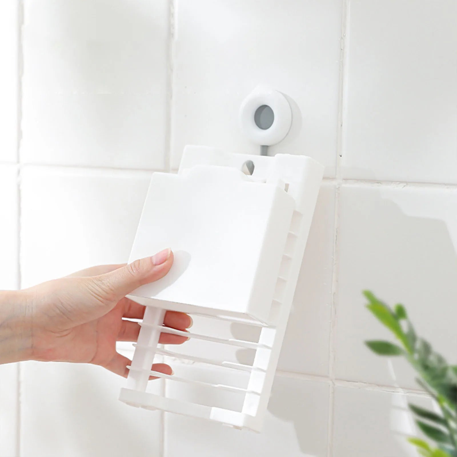  Folding mechanism of the dish drying rack, demonstrating the space-saving feature for easy storage in compact spaces.