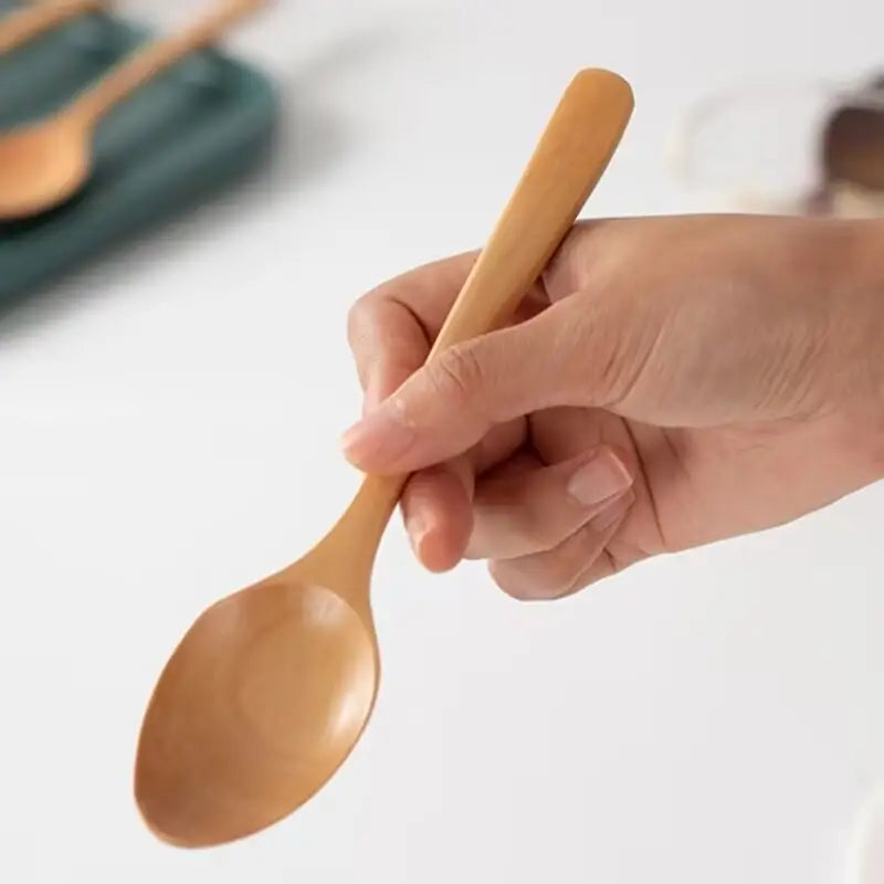 Highlighting the eco-friendly material of the wooden spoons.