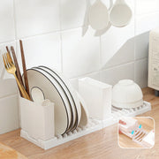Foldable dish drying rack in a modern kitchen, showcasing vertical space-saving design for organizing plates, bowls, and utensils.