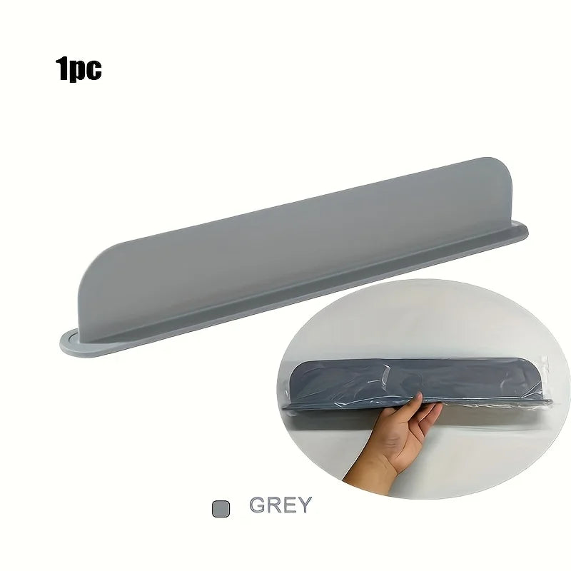 Silicone water barrier collapsed flat for compact storage.