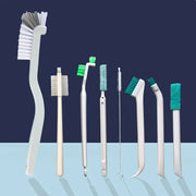 Narrow cleaning brush for the kitchen, showcasing the ergonomic handle and soft bristles ideal for small spaces.
