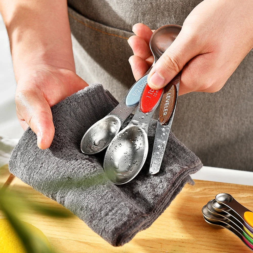 Close-up showing the magnetic feature of the measuring spoons for easy storage
