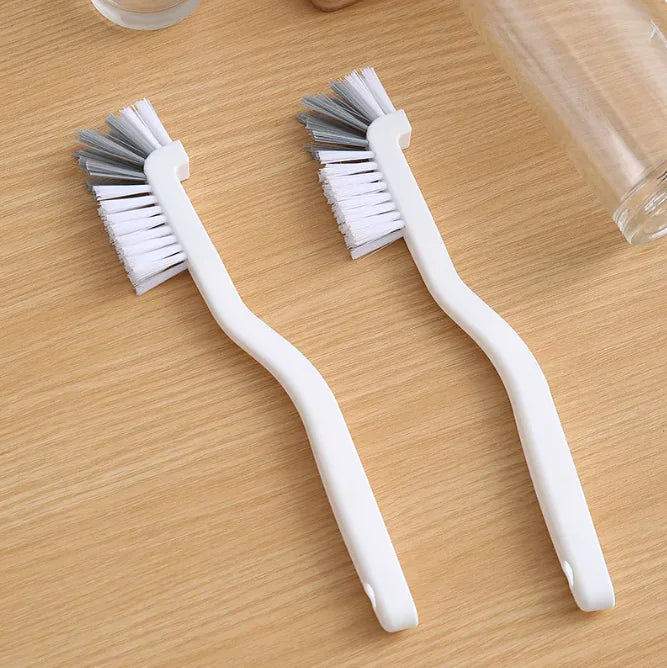 Narrow cleaning brush effectively cleaning a milk bottle, highlighting its utility for various bottle types.