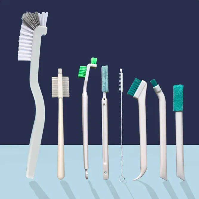 Narrow cleaning brush effectively cleaning a glass bottle with its long handle, reaching difficult areas.
