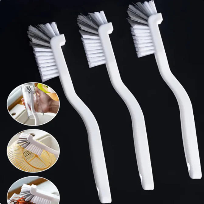  Narrow cleaning brush displayed next to other essential kitchen accessories, showing its place in a complete cleaning kit.