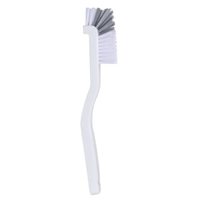  Close-up of the plastic bristles on the narrow kitchen cleaning brush, designed for gentle yet effective cleaning.
