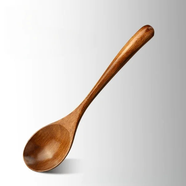 The wooden spoon set in use, stirring a pot, showing its practical application in the kitchen.
